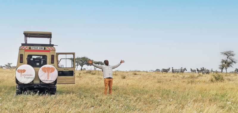 Happy Guide with a Land Cruiser